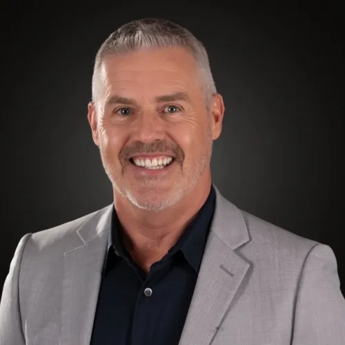 Paul D smiling in a professional setting